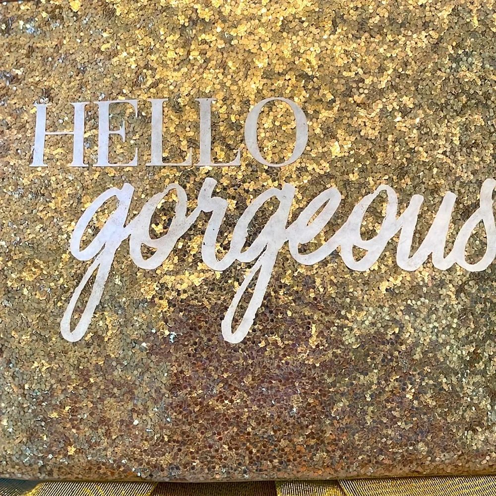 Gold metallic top zip cosmetic or inside purse bag. GUC “Hello Gorgeous”